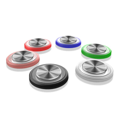 Set of six metallic spinning tops in different colors on a white background