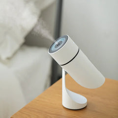 White humidifier on a wooden surface with a blurred background