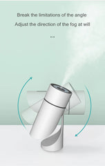 White handheld device emitting fog with text on a light green background