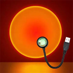 Small round light with USB cable on a red background