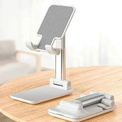 Phone holder on a wooden surface with a blurred background