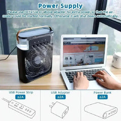 Air cooler on a desk with a laptop and power supply options displayed.