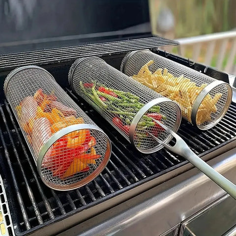 Metal mesh grilling baskets with vegetables on a grill