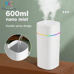White humidifier with rainbow design on a wooden surface and green background, featuring text about its features.