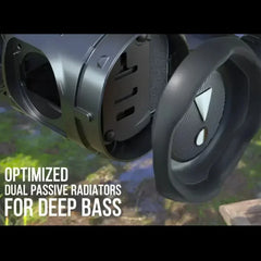 Close-up of a speaker with optimized dual passive radiators for deep bass, set against a natural background.