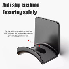 Black phone holder with anti-slip cushion on a white background