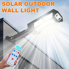 Solar outdoor wall light with remote control on a clear sky background