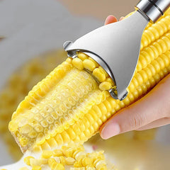 Corn shucker being used to remove kernels from a cob