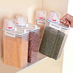 Set of kitchen storage containers with measuring lids filled with different grains.