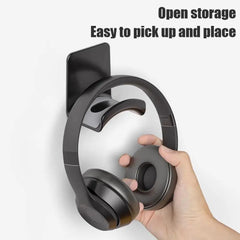 Headphone storage hook with headphones on a white background