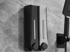 Black and silver shower system mounted on a tiled wall