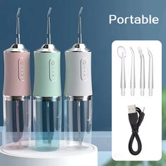 Three portable dental water flossers with accessories on a blue background