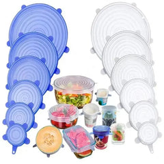 Set of blue and clear silicone food covers on a white background
