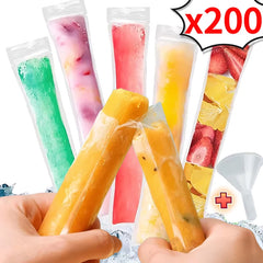 Assorted fruit popsicles in packaging with a hand holding one, on a white background.