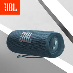 JBL portable speaker on a gray background with JBL logo above