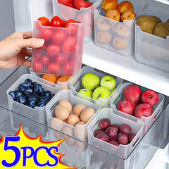 Fridge organizer with compartments for fruits and vegetables, showing a hand picking up a container of tomatoes.
