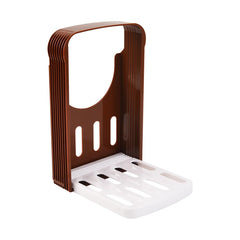 Brown and white kitchen sponge holder on a white background