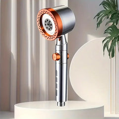 Shower head with copper accents on a neutral background