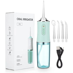 Teal oral irrigator with packaging, nozzles, and USB cable on a white background