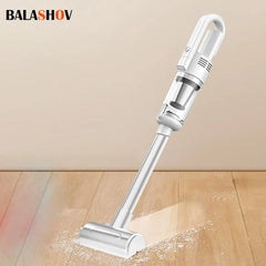 White handheld vacuum cleaner cleaning a wooden floor with 'BALASHOV' branding.