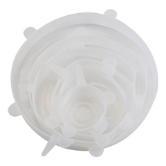 Set of white silicone stretch lids on a white background