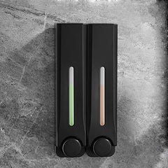 Black soap dispenser with digital display on a gray stone surface