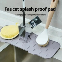 Faucet splash proof pad with kitchen tools on a sink