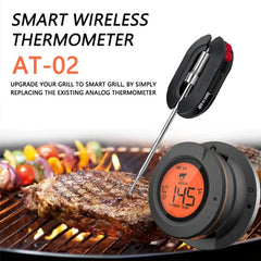 Smart wireless thermometer AT-02 on a grill with steak and vegetables.