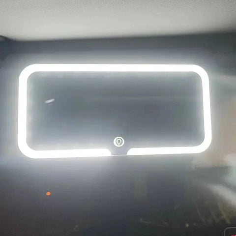 Rectangular light fixture with a white border on a dark background