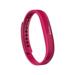 Pink fitness tracker band on a white background