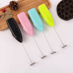 Set of colorful milk frother tools on a white background