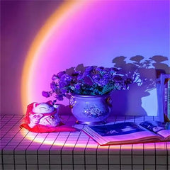 Decorative setup with a pot of flowers, a small figurine, and an open book on a checkered floor with a colorful light arch.
