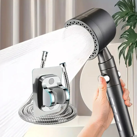 Handheld shower head with flexible hose held by a hand, with a neutral background.
