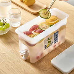 Rectangular plastic container with sliced fruits on a wooden table