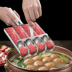 Metallic meatball maker being used to form meatballs into a hot pot with ingredients.