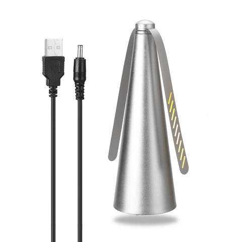 Metallic cone-shaped device with USB and DC connectors on a white background