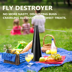 Black fly destroyer product on a picnic blanket with fruits, drinks, and people in the background.