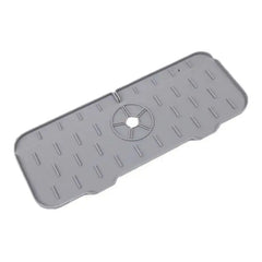 Gray rubber mat with a central hole on a white background