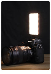 Nikon camera with a flash on a dark background