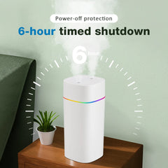 White humidifier on a wooden nightstand with a plant, featuring text about a 6-hour timed shutdown.