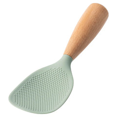 Green kitchen spatula with wooden handle on a white background