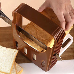 Brown bread slicer cutting slices of bread on a wooden surface