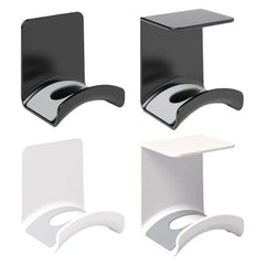 Two black and two white wall-mounted shelves on a white background