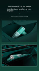 Teal handheld vacuum cleaner with text on a dark background
