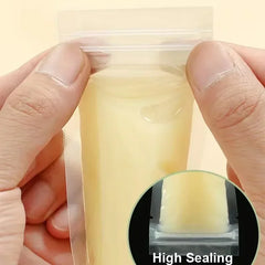 Hand holding a small container with a clear lid, showing high sealing feature.