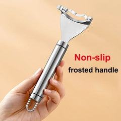 Metal fruit peeler with non-slip frosted handle held by a hand on a beige background